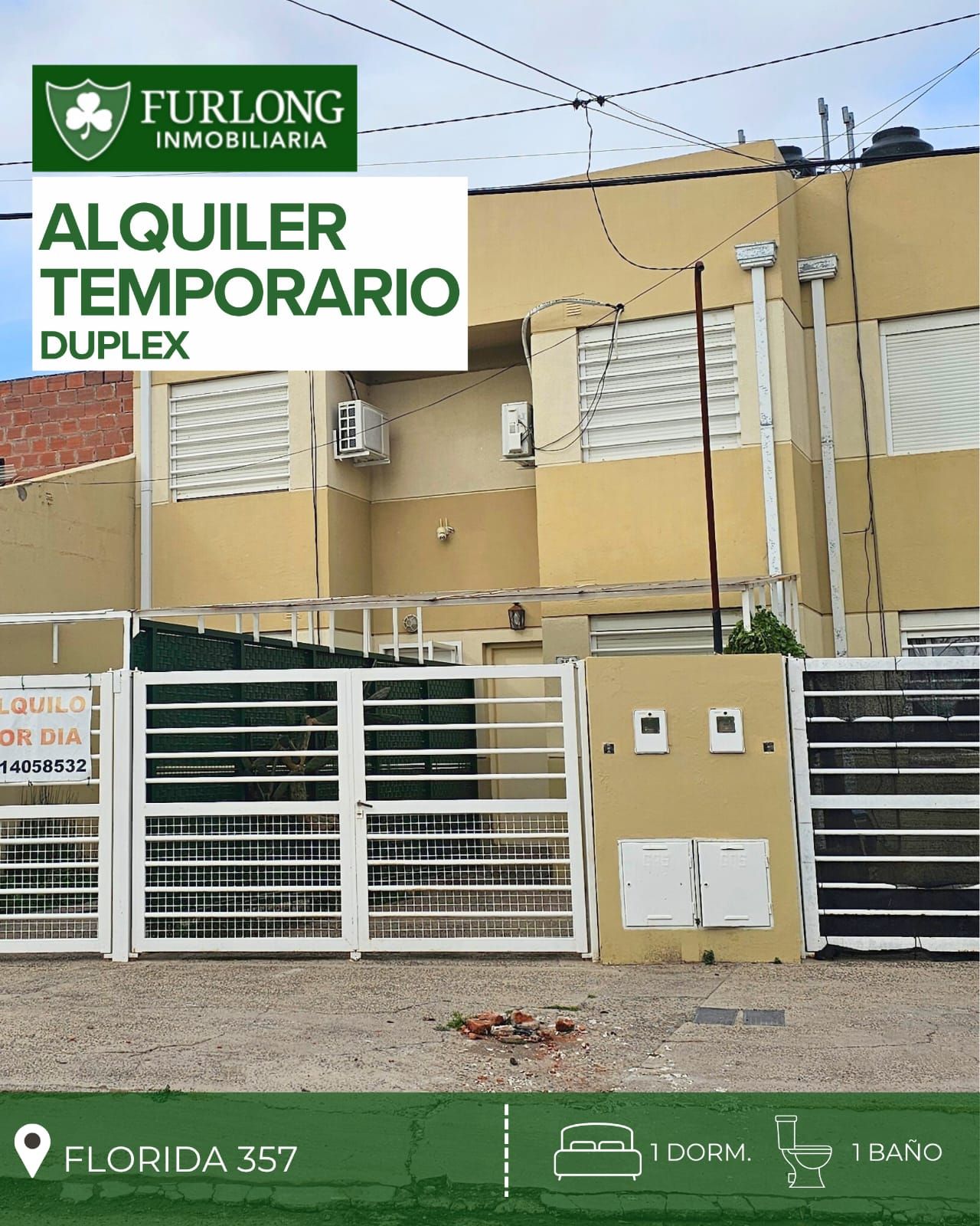La imagen muestra un dúplex en alquiler temporal. El exterior está en buen estado de conservación, con paredes de color beige y detalles en blanco. La fachada presenta ventanas con persianas y un portón de rejas metálicas blancas, lo que sugiere seguridad. La iluminación natural parece adecuada gracias a las ventanas. El entorno es urbano, con pavimento en la calle y aceras. Destaca la presencia de un pequeño jardín frontal. La propiedad está ubicada en Florida 357 y cuenta con un dormitorio y un baño, según la información proporcionada.